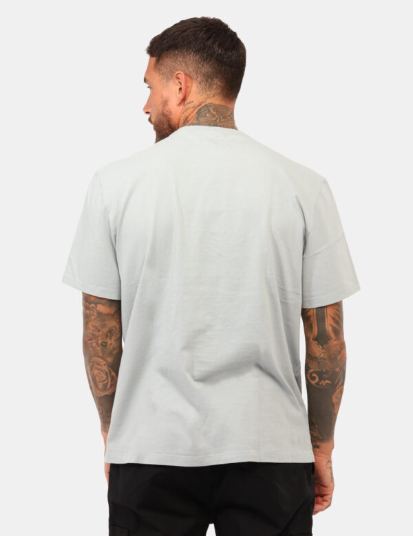 T-shirt Calvin Klein Azzurro - T-shirt classica in total azzurro con stampa in rilievo grigia. La vestibilità è morbida e re