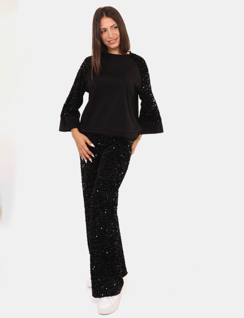 Pantaloni Rue De Clerie Nero - Luminosi pantaloni larghi in total nero, ricoperti di paillettes. La vestibilità è morbida e