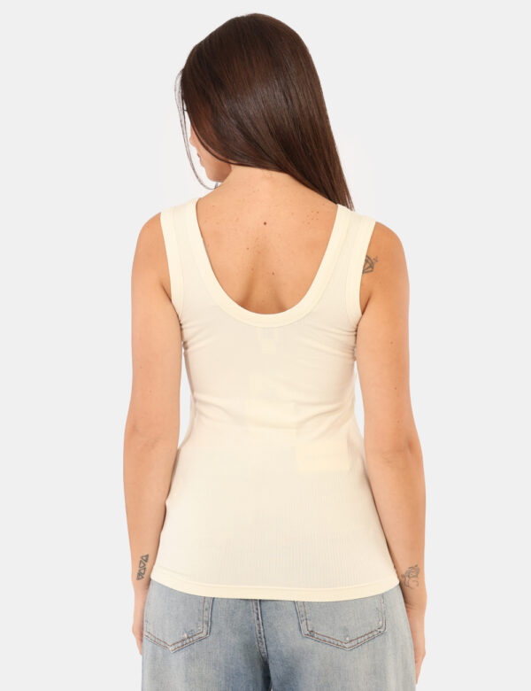 Top Calvin Klein Bianco - Top senza maniche, in total panna con logo brand ricamato bordeaux. La vestibilità è morbida e re