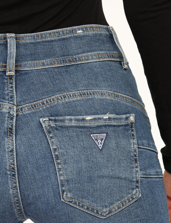 Jeans Guess Jeans - Jeans classico in total blu denim slavato, con tasche sagomate caratterizzate da glitter argentati, più