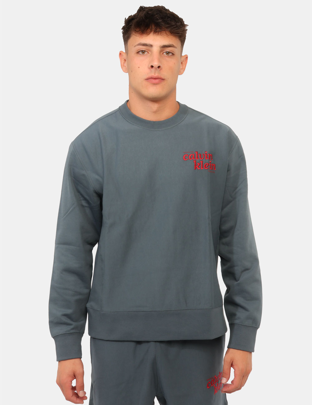 LV04RG265G_CEG_AI26_7 Felpa Calvin Klein Blu - Felpa CALVIN KLEIN Blu da uomo La Felpa CALVIN KLEIN Blu è il capo ideale per chi desidera uno stil